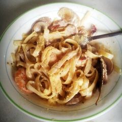 A picture of fettucine seafood carbonara.