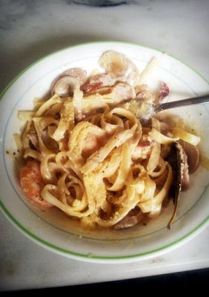 A picture of fettucine seafood carbonara.