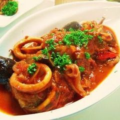 A picture of Squid and Eggplants in Tomato Sauce.