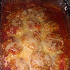 A picture of Chicken balls in tomato sauce.