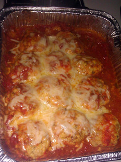 A picture of Chicken balls in tomato sauce.