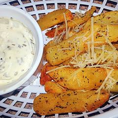 A picture of Garlic Herb Parmesan fries &* Pesto Garlic Aioli*.