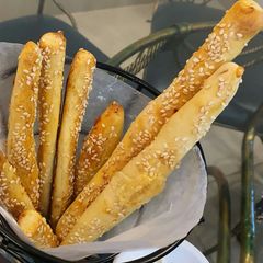 Cheesy bread sticks with hot and sour chicken soup A picture of Cheesy bread sticks with hot and sour chicken soup.