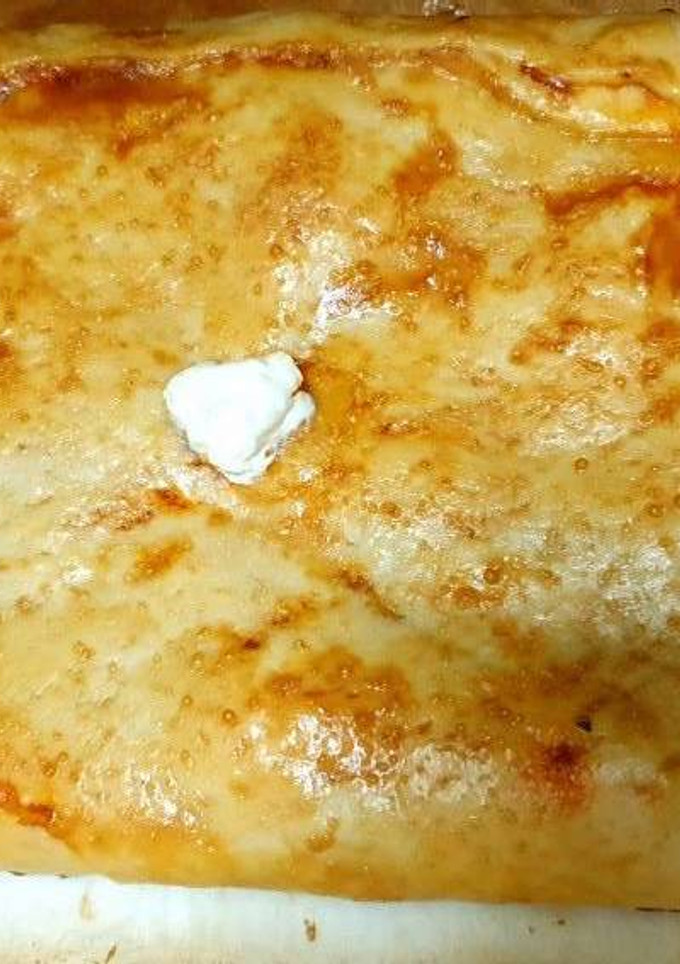 Una foto de Empanada de pavo, queso y tomate