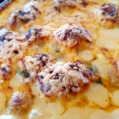 A picture of Cheesey, jalapeno, sweet mustard saucy baby potatoes.