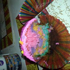 A picture of rainbow cupcakes.