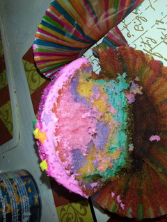 A picture of rainbow cupcakes.