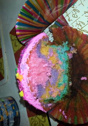 A picture of rainbow cupcakes.
