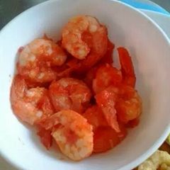 A picture of Shrimps with tomato sauce.