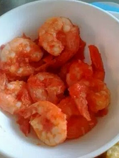 A picture of Shrimps with tomato sauce.