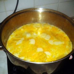 Scalloped potatoes on stove top A picture of Scalloped potatoes on stove top.