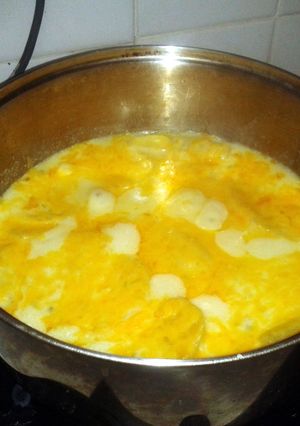 A picture of Scalloped potatoes on stove top.