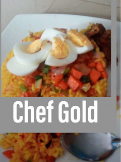 A picture of Turmeric rice garnished with veggies and boiled eggs.