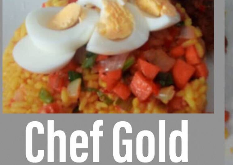 Turmeric rice garnished with veggies and boiled eggs