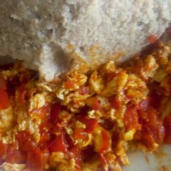 A picture of Fried eggs with Brown Ugali.