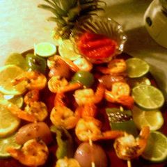 A picture of grilled shrimp kabobs.