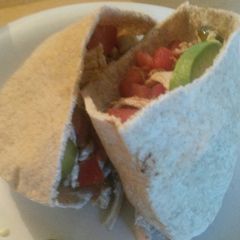 A picture of Olive oil and vinegar chicken salad pitas.