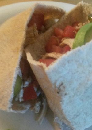 A picture of Olive oil and vinegar chicken salad pitas.