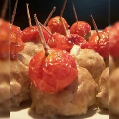 A picture of AMIEs Baked MEATballs with Cherry Tomatoes.