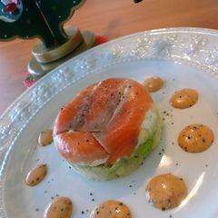 A picture of Layered Salmon and Avocado with a Thick Dressing.