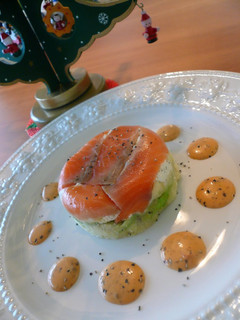 A picture of Layered Salmon and Avocado with a Thick Dressing.
