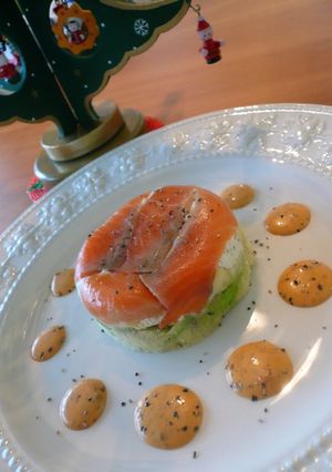 A picture of Layered Salmon and Avocado with a Thick Dressing.
