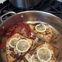 A picture of Swordfish W/ Sundried Tomatoes, Parsley, and Lemon, and Pesto Farfale.