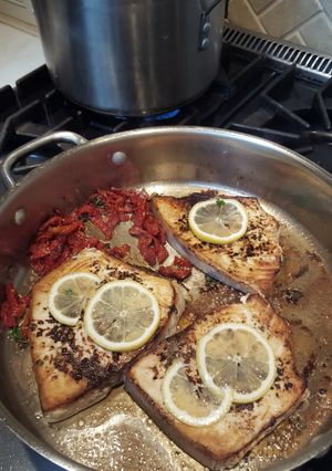 A picture of Swordfish W/ Sundried Tomatoes, Parsley, and Lemon, and Pesto Farfale.
