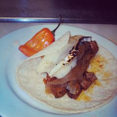 Prime rib taco with melted brie cheese A picture of Prime rib taco with melted brie cheese.