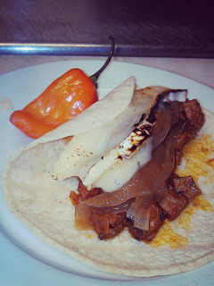 A picture of Prime rib taco with melted brie cheese.
