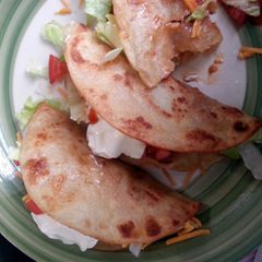 A picture of spicy shredded chicken tacos.