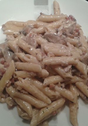 A picture of Four cheese penne with mushrooms, pancetta and toasted walnuts.