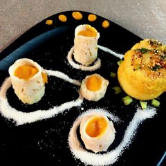 A picture of SEMOLINA DHOKLA SHOT GLASS with MONGO RAS (ras - dhokla).