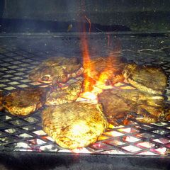 shoulder steak on the grill A picture of shoulder steak on the grill.
