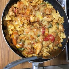 A picture of Chicken breast on Rigate cheese pasta.