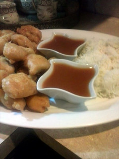 A picture of Sweet and sour sauce with chicken tempura.
