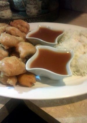 A picture of Sweet and sour sauce with chicken tempura.