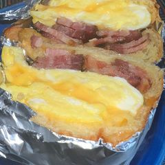 A picture of Bacon Egg Cheese on Freshly Baked Croissant.