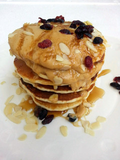 A picture of Cashew Nut Pancake Top Peanut Butter And Honey.