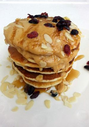 A picture of Cashew Nut Pancake Top Peanut Butter And Honey.
