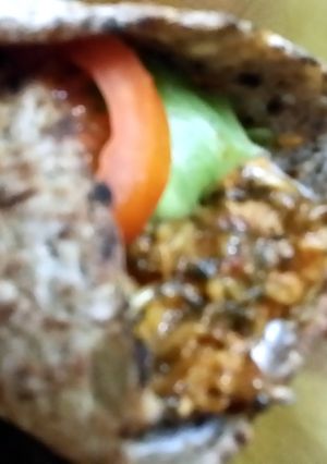 A picture of High protein spicy chicken spinach wrap.