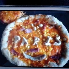 A picture of pizza dough - cheese and garlic crusted.