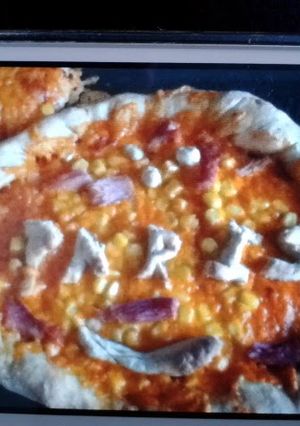 A picture of pizza dough - cheese and garlic crusted.