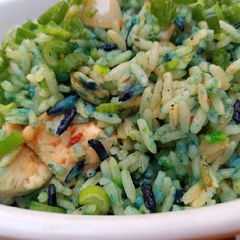 A picture of Coloured chicken stir fried rice.