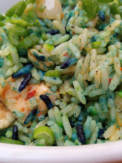 A picture of Coloured chicken stir fried rice.