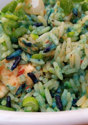 A picture of Coloured chicken stir fried rice.