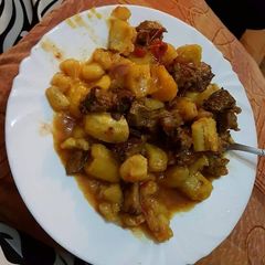 A picture of Matoke and beef stew.