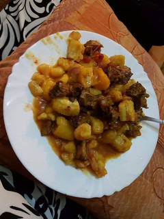 A picture of Matoke and beef stew.