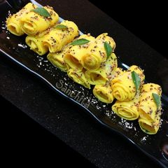 Coconut stuffed Mango Khandvi A picture of Coconut stuffed Mango Khandvi.