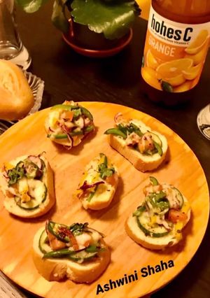 A picture of Cheese Bruschetta with vegetables.